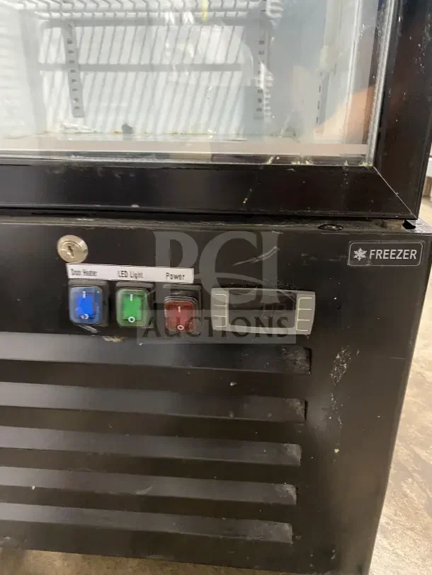 Commercial black gelato freezer with glass door, model SD240, LED light, door heater, and poly-coated wire racks on casters.