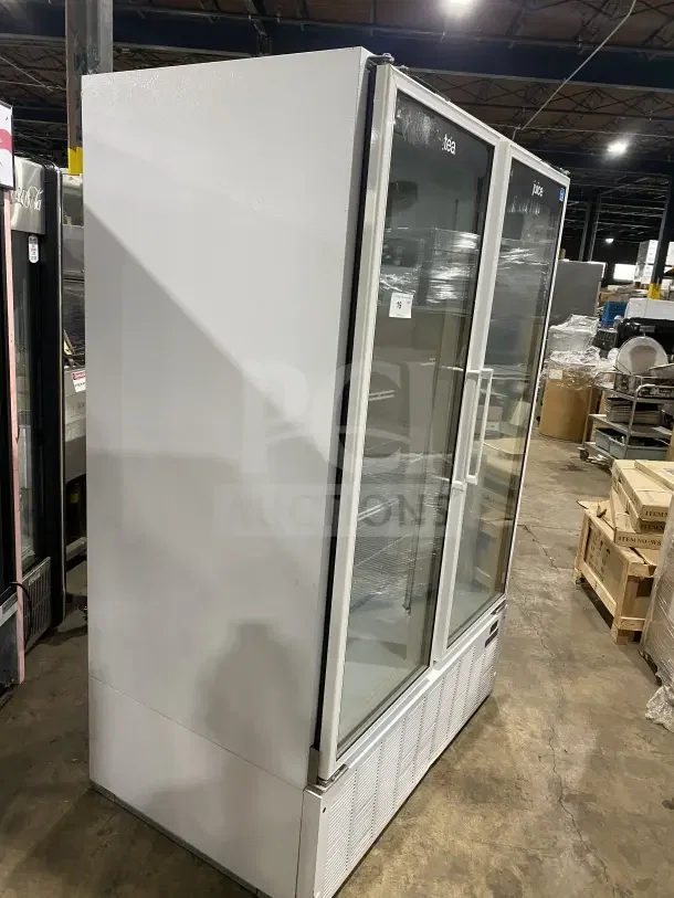 Master Bilt BMG-48 commercial reach-in freezer with two glass doors, poly coated wire racks, model number visible.
