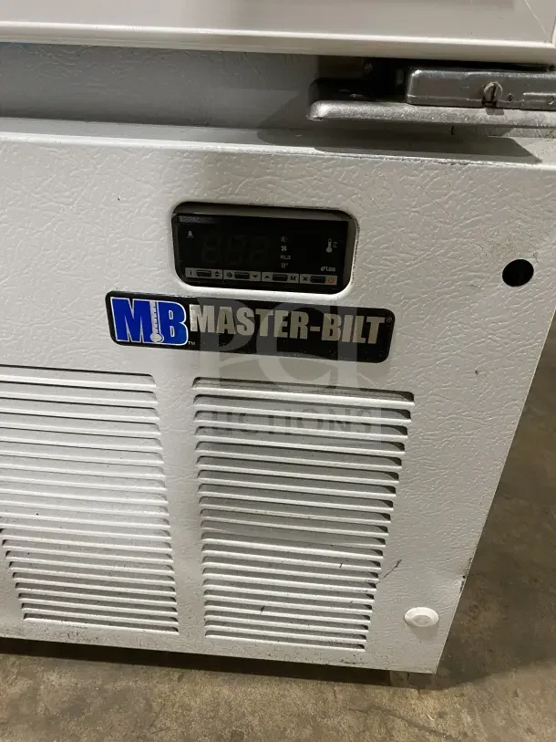 Master Bilt glass 2-door reach-in freezer, model BMG-48, SN: 158572ICC01, with poly-coated wired rack and digital display.