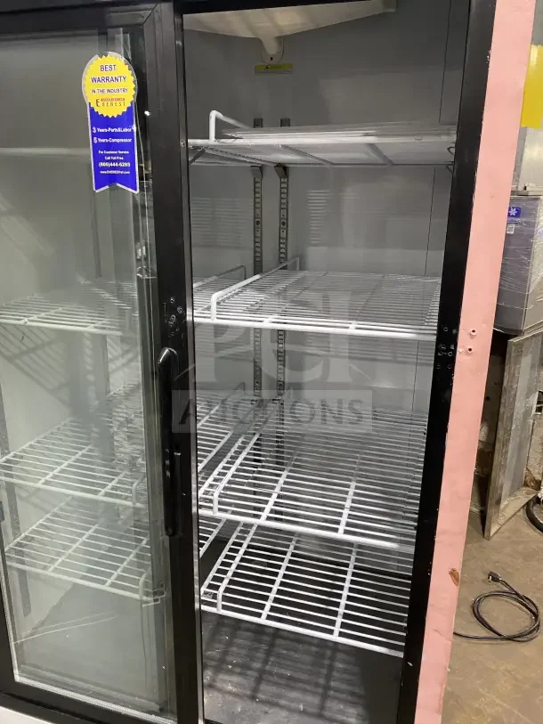 Everest EMGR33 commercial refrigerator with double glass sliding doors, poly coated wire racks, and warranty label.
