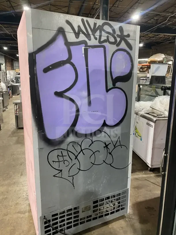 Everest EMGR33 commercial double glass door refrigerator with poly coated wire rack, graffiti on side, 115V, used condition.