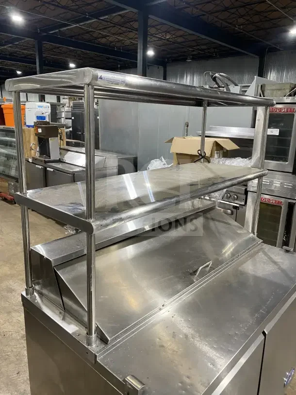 Entree S48 refrigerated salad prep table, stainless steel, double overhead shelf, on casters, 2 doors, SN: 1107CONH01175.