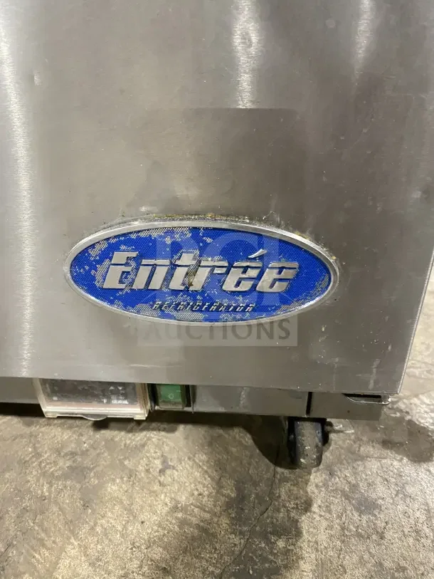 Entree S48 stainless steel 2-door refrigerated prep table, double overhead shelf, on casters, model and serial number tag shown.