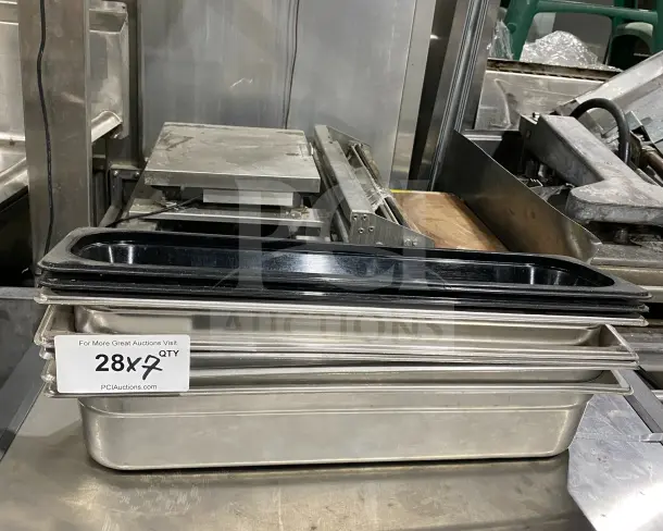 Commercial stainless steel heavy-duty prep trays, ideal for cinnamon rolls or salads. Multiple units available.