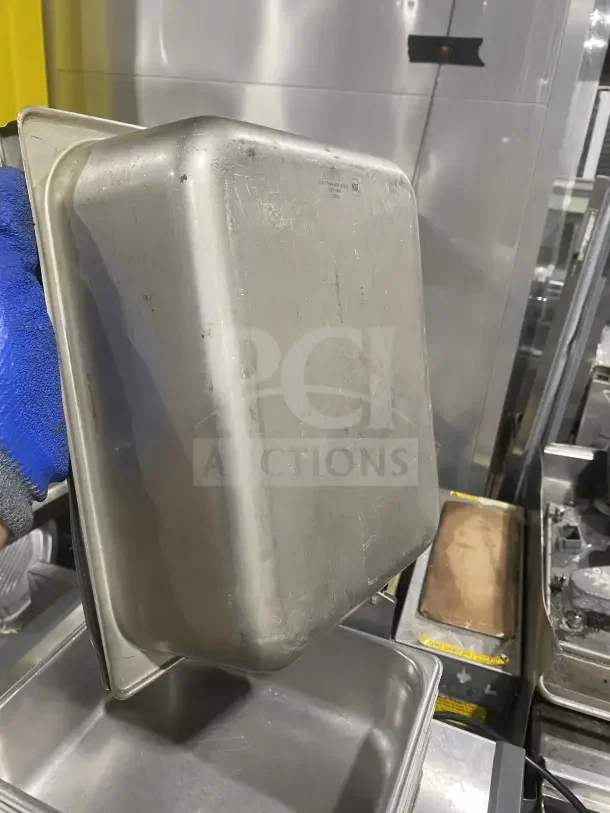 Commercial stainless steel prep tray, used condition, scratches visible. Marked NSF certified. Ideal for sauces or salads.