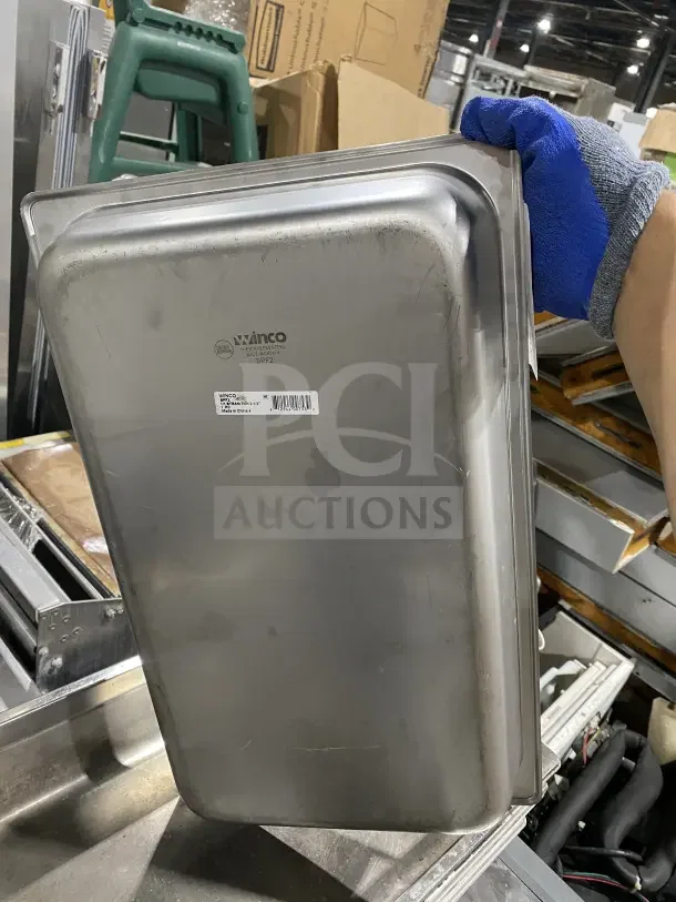 Winco stainless steel baking tray SPF2, gently used, with minor scratches. Dimensions on label suggest commercial use.