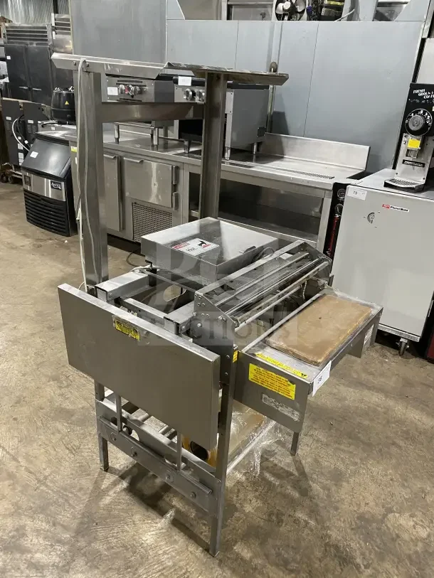 Commercial stainless steel floor-model wrapping station, model 0662, on casters and legs, 120V, SN: 0440300007.