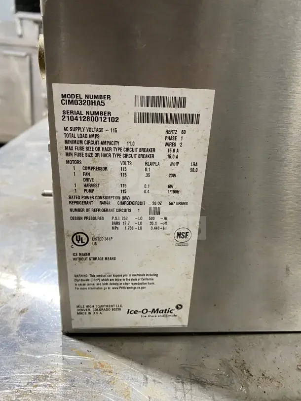 Ice O Matic Elevation Series 22" commercial ice machine, model IM0320HA, air-cooled, 115V, half dice cube. Manufacturing label visible.
