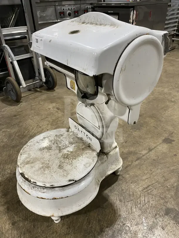 Dayton Commercial white porcelain moneyweight countertop computing scale, vintage, shows wear and rust, Dayton logo visible.