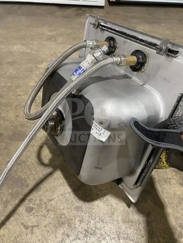Commercial stainless steel drop-in hand sink with faucet; includes flexible hoses and visible installation hardware.