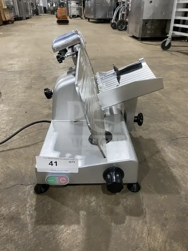 Avantco 250ES10 commercial meat slicer with 10-inch blade, stainless steel, and legs. Semi-automatic, 110/120V, excellent condition.