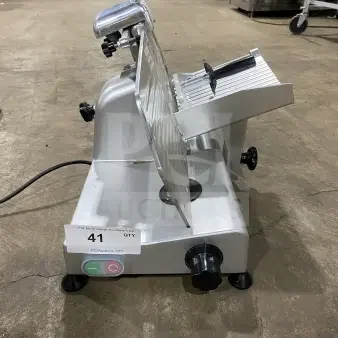 Avantco 250ES10 commercial meat slicer with 10-inch blade, stainless steel, and legs. Semi-automatic, 110/120V, excellent condition.