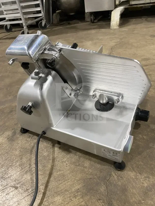 Avantco 250ES10 commercial countertop meat slicer with 10-inch stainless steel blade, semi-automatic, on legs, in good condition.
