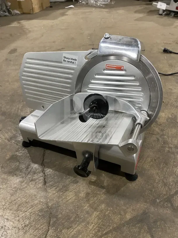 Avantco 250ES10 commercial meat slicer, semi-automatic, 10-inch blade, all stainless steel, excellent condition, on legs.