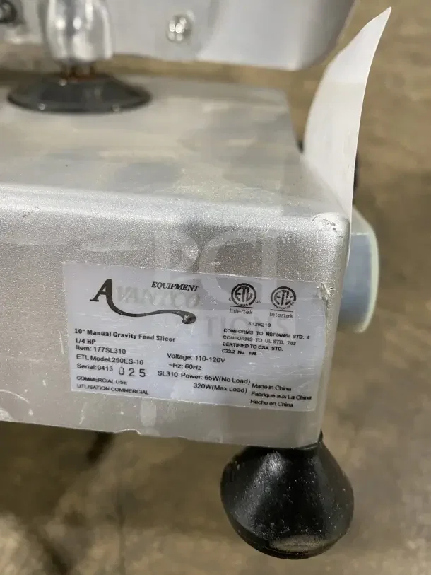 Avantco 250ES10 commercial meat slicer, 10" blade, stainless steel, semi-automatic, 110/120V, serial 0413025, on legs.