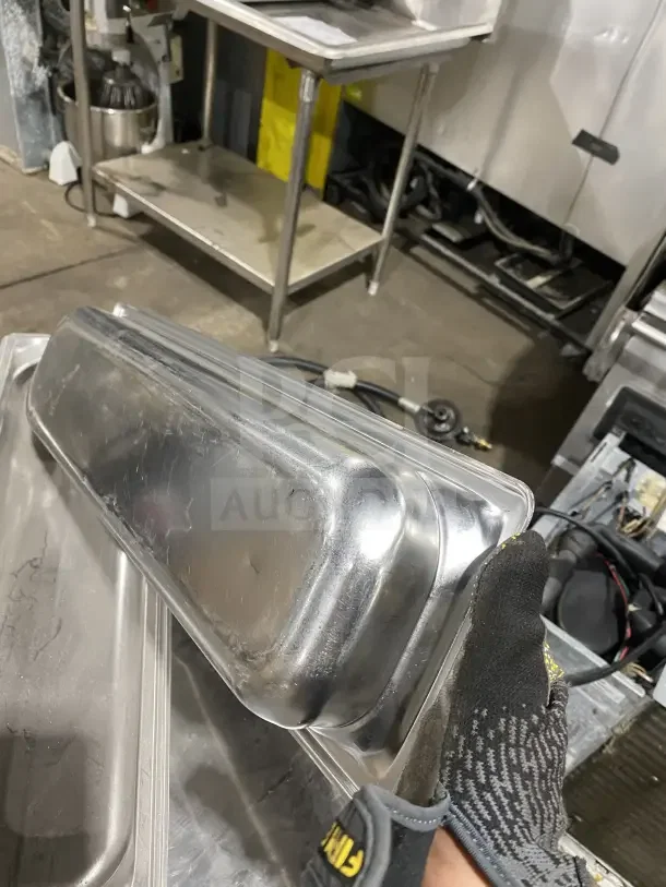 Commercial stainless steel full-size hotel pans, set of six, in used condition. Durable with some surface scratches.