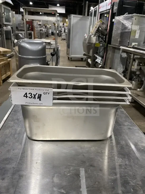 Winco Commercial Stainless Steel Half-Size Hotel Pans, Model SPJL306, set of 4. Stacked, in good condition.