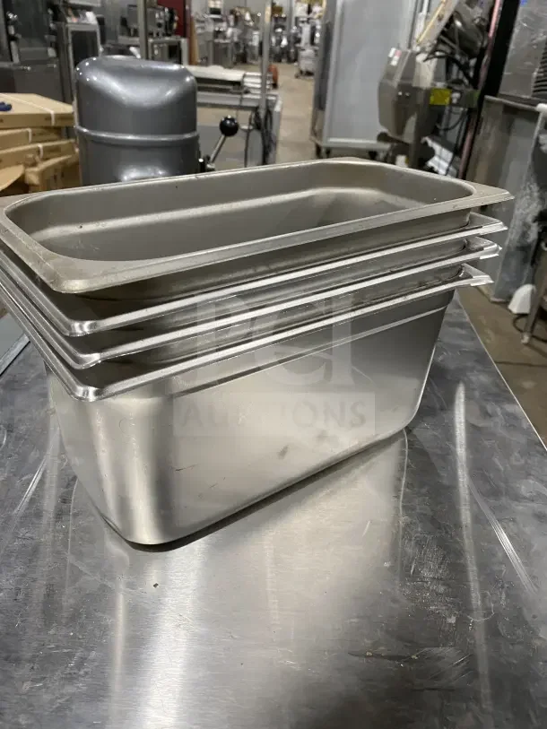 Winco SPJL306 stainless steel half-size hotel pans, stack of four, commercial grade, used condition.