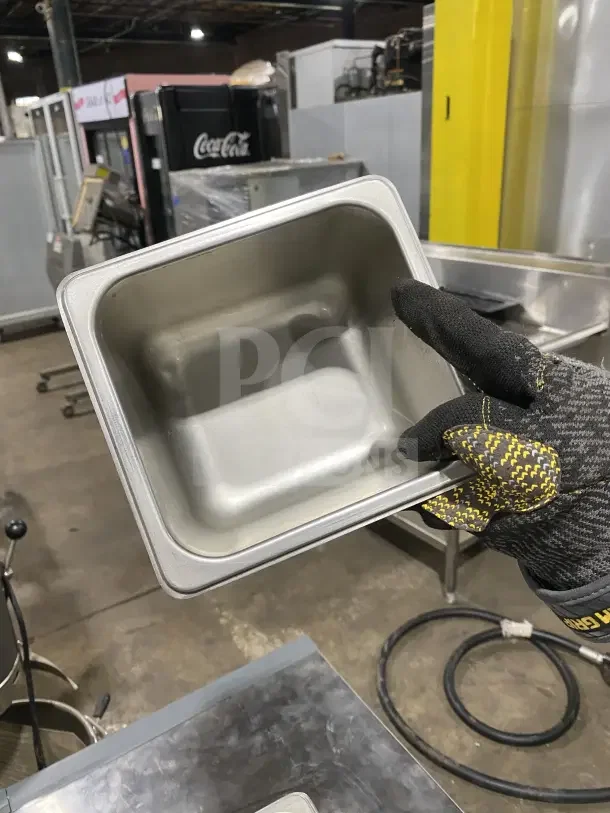 Commercial stainless steel sixth-size food pan, durable, showing pristine condition, ideal for hotel use.