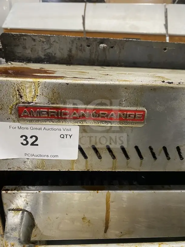 American Range stainless steel countertop salamander broiler, used, visible wear. Red logo, auction label "32" attached.