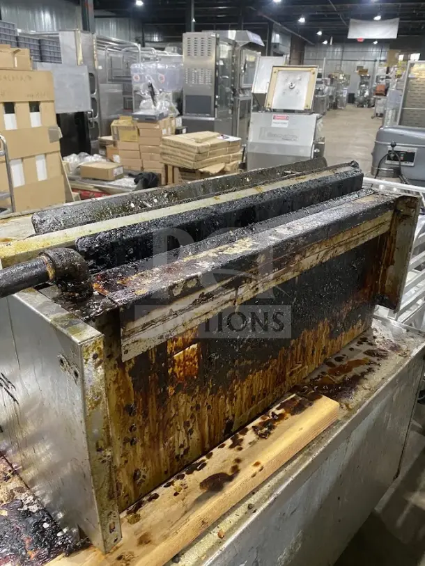 American Range stainless steel countertop salamander broiler, used condition with visible grease buildup, ideal for commercial kitchens.