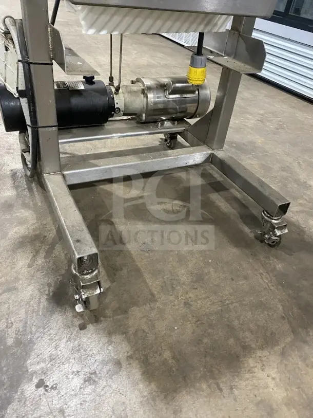 Goodnature Commercial Stainless Steel Hydraulic Cold Press Juicer on casters, used condition, visible motor and hydraulic components.
