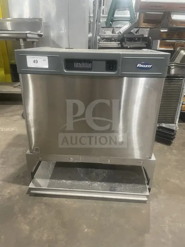Follett commercial stainless steel under-counter ice storage bin/dispenser base, excellent condition, with visible brand logo.