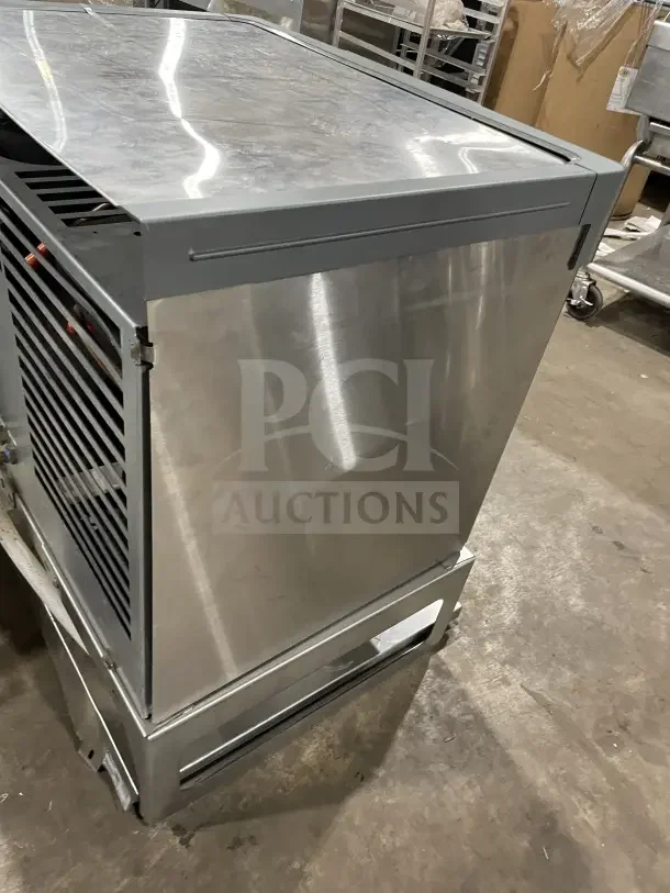 Follett commercial under-counter stainless steel ice storage bin and dispenser base in good condition.