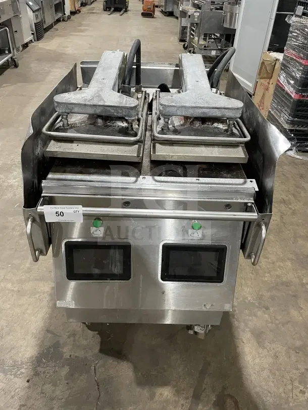 Garland XPG24 stainless steel 24" natural gas clamshell griddle with dual platens, back and side splashes, on casters.