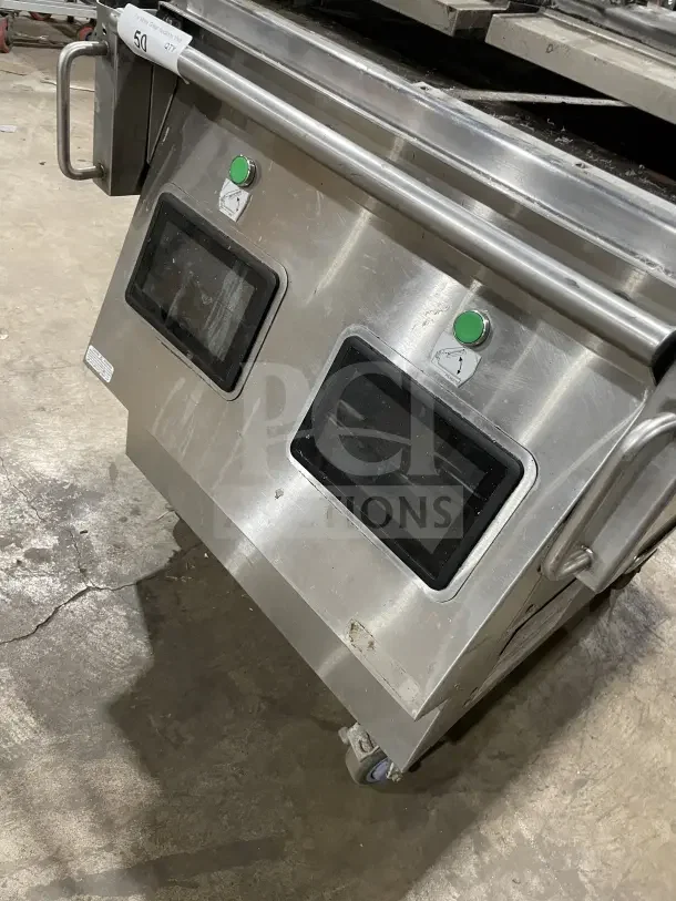 Garland XPG24 stainless steel clamshell griddle with dual platens, back and side splashes, on casters. Model and voltage details visible.