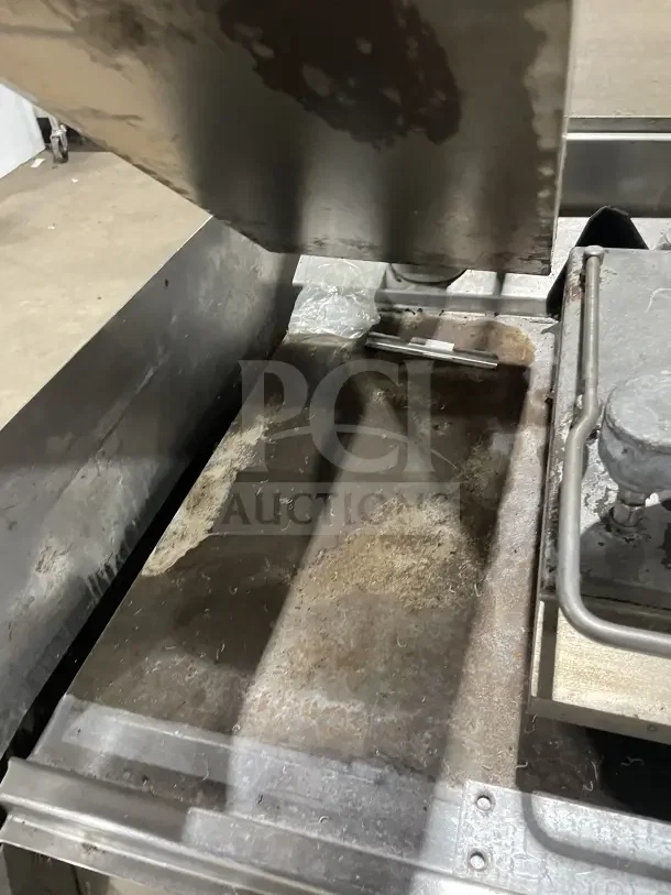Garland XPG24 stainless steel clamshell griddle, dual platens, back/side splashes, on casters, natural gas, used condition.