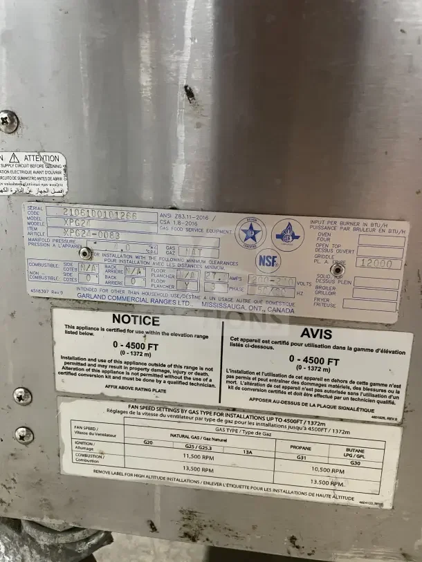 Garland Commercial Stainless Steel 24" Natural Gas Clamshell Griddle, Model XPG24, tags indicate dual platens, 200-240V, 3 phase.