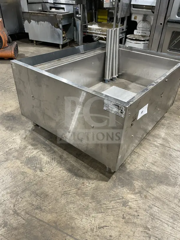 Krowne commercial stainless steel cold plate/ice bin with legs, used condition, visible manufacturer label, sturdy build.