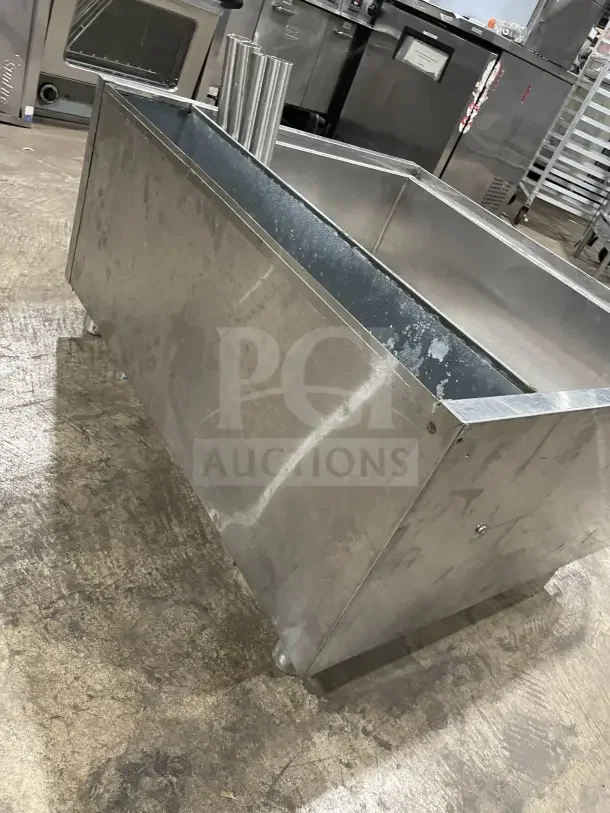 Krowne stainless steel cold plate/ice bin with legs, commercial-grade, used condition, visible wear; ideal for bar use.