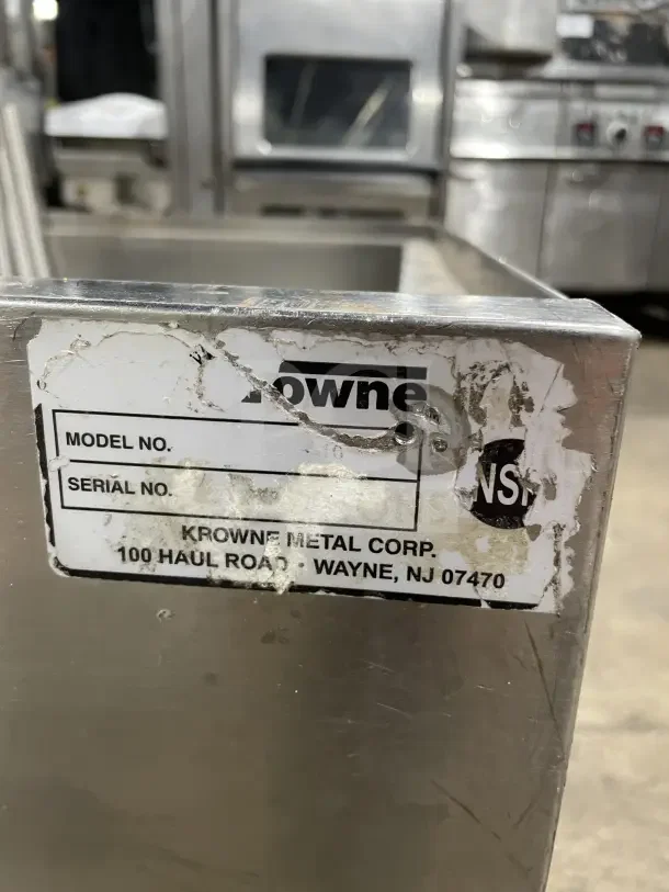 Krowne commercial stainless steel cold plate/ice bin with legs, visible label showing Krowne Metal Corp., Wayne, NJ.