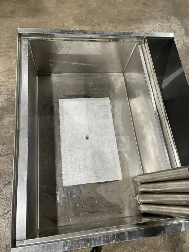 Krowne commercial stainless steel cold plate/ice bin with legs, in used condition, featuring a sturdy metal design.