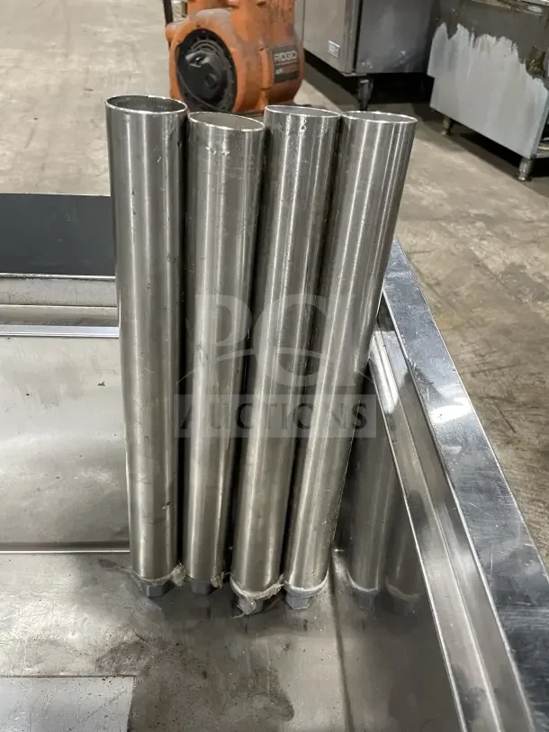 Krowne stainless steel cold plate/ice bin with legs, commercial-grade, visible cylindrical legs, sturdy condition.