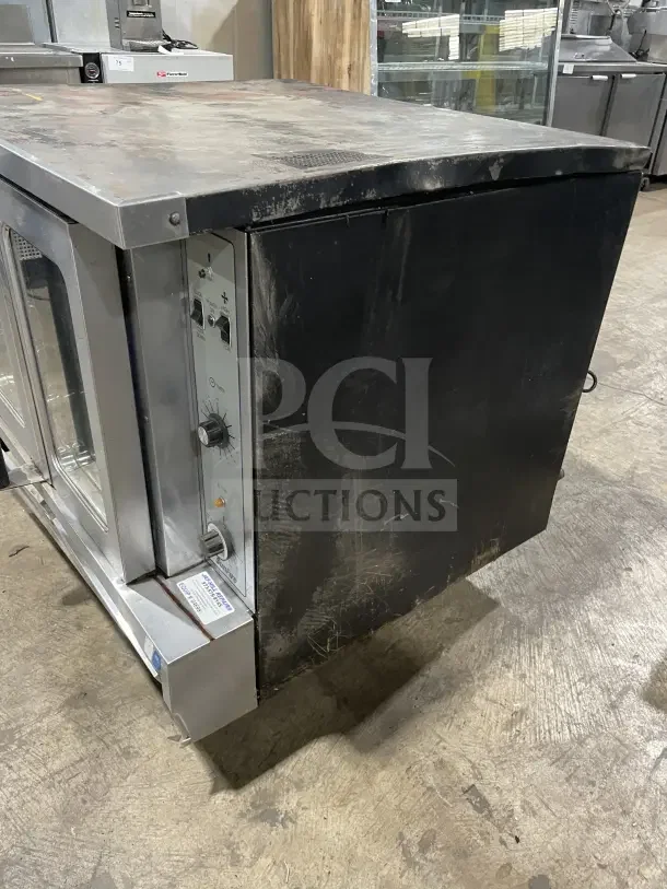 Sunfire commercial stainless steel gas-powered convection oven, single stack, includes oven wire rack, shows signs of wear.