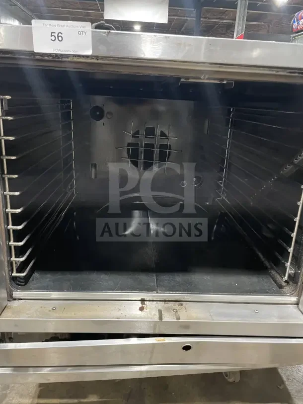 Sunfire Commercial Stainless Steel Convection Oven with wire rack, gas-powered, single stack, open door view, auction tag.