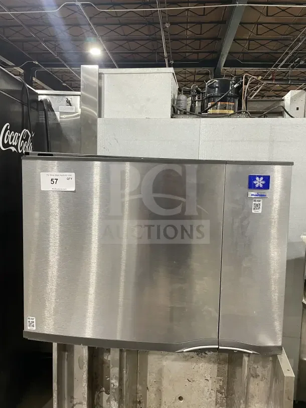 Manitowo SD0452A stainless steel electric ice maker, stand-mounted, lift-open access, commercial grade, visible model label.