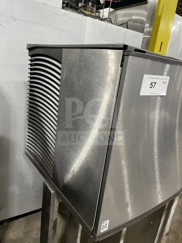 Manitowo SD0452A commercial stainless steel ice maker, electric powered, with lift-open access, on legs, excellent condition.