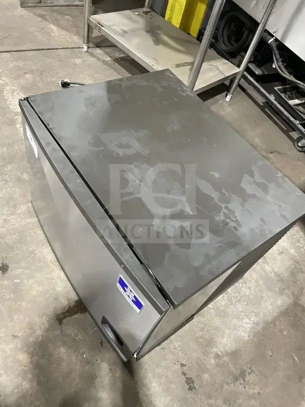 Manitowoc IY0606A261 stainless steel ice machine head, serial number 1120402941, in used condition.
