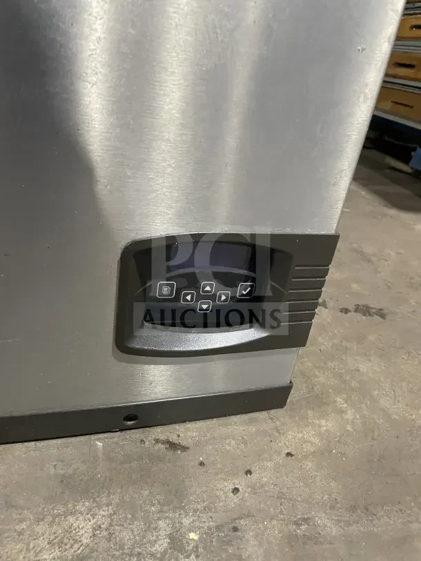 Manitowoc commercial stainless steel ice machine head, model IY0606A261, with control panel visible.