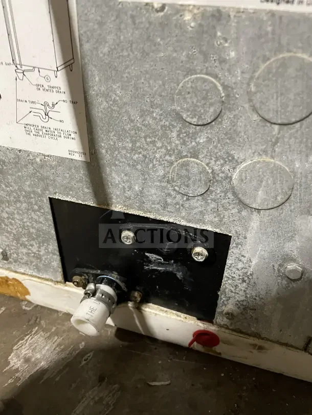 Manitowoc stainless steel ice machine head, model IY0606A261, SN 1120402941. Good condition, visible drain installation guide.