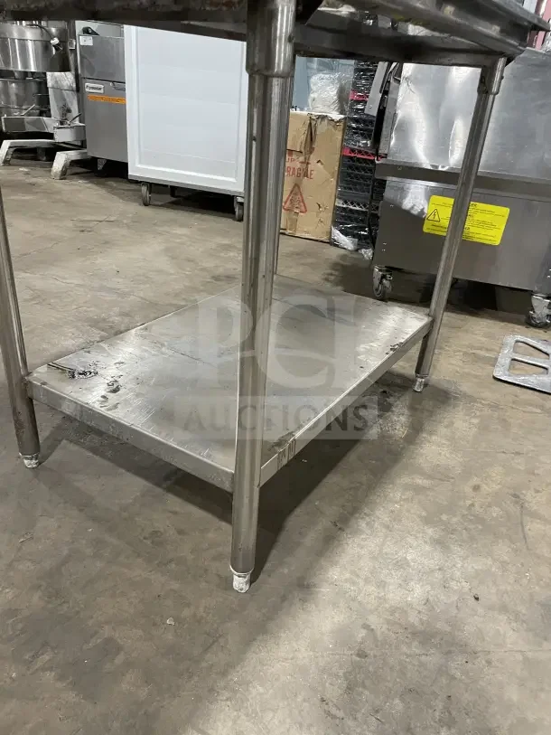 Stainless steel soiled dish table with backsplash on casters, good condition, suitable for commercial use.