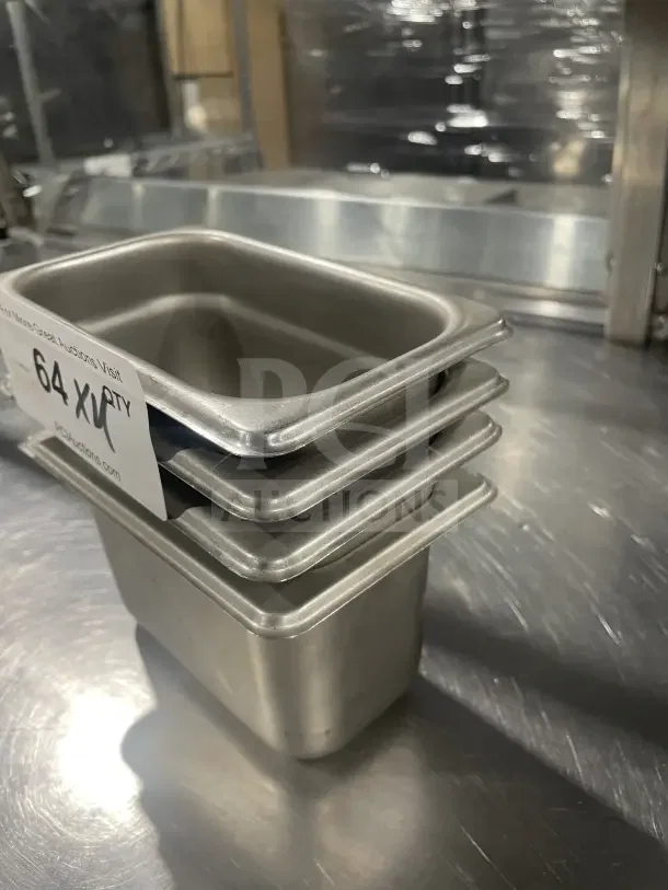 Winco SPN4 stainless steel half-size steam table pan, stacked, excellent condition, auction tag indicates 64 quantity.