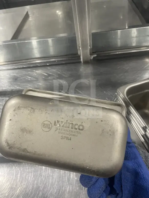 Winco Commercial Stainless Steel Half-Size Steam Table Pan, Model SPN4, NSF certified, shows signs of wear.