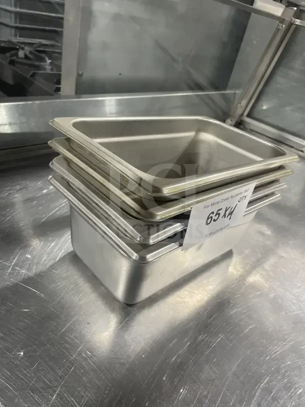 Winco SPJL404 stainless steel half-size steam table pans, stack of four, used condition, visible auction tag "65KH".