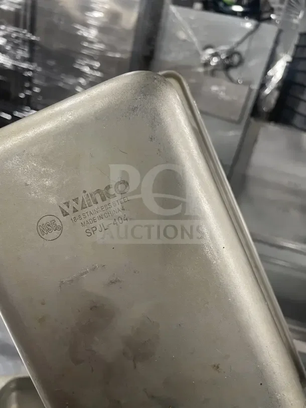Winco commercial stainless steel half-size steam table pan, model SPJL404. Visible NSF marking, gently used condition.
