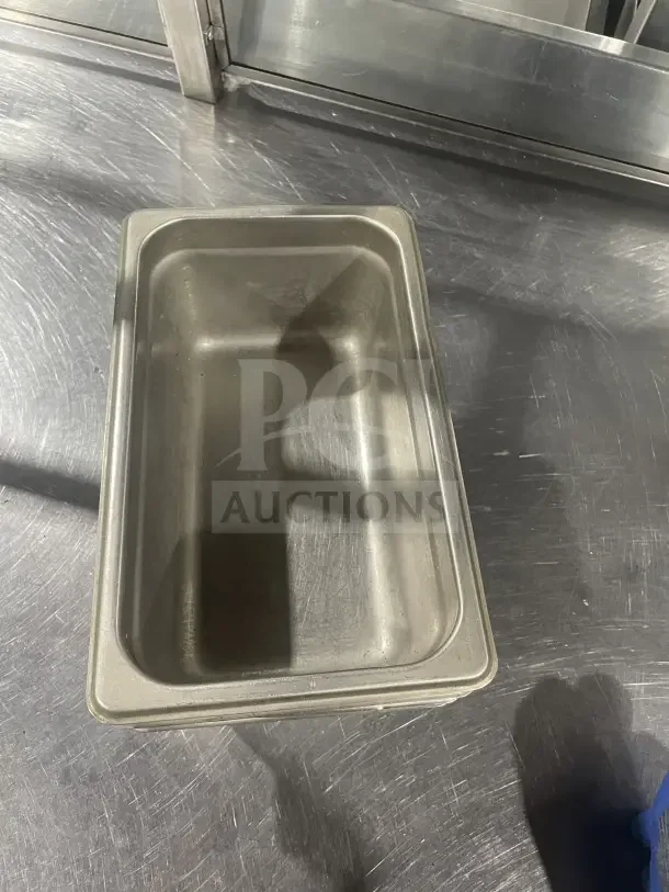 Winco SPJL404 stainless steel half-size steam table pan, commercial grade, polished finish, in good condition.